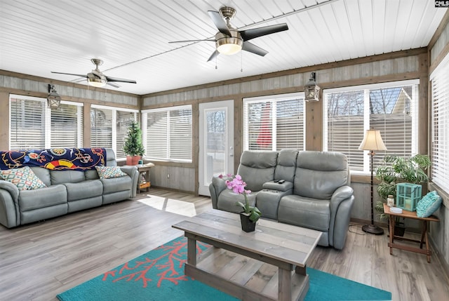 sunroom with a ceiling fan