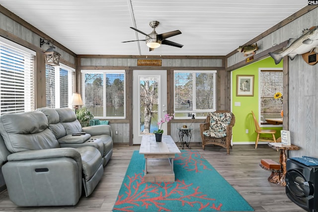 sunroom with a ceiling fan