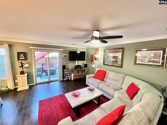 living area with baseboards, crown molding, hardwood / wood-style floors, and ceiling fan