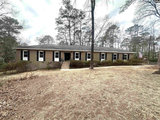 ranch-style home with brick siding