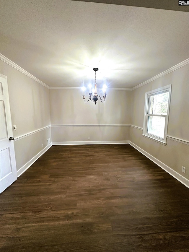 unfurnished dining area featuring a chandelier, ornamental molding, baseboards, and dark wood-style floors