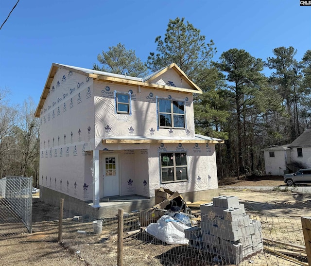 property under construction featuring fence