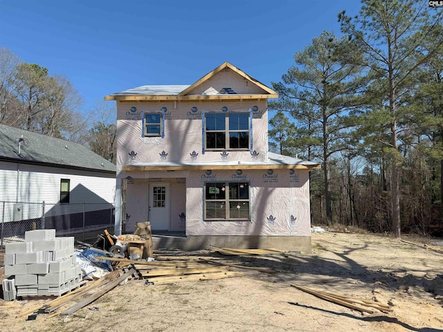 view of front of property with fence and stucco siding