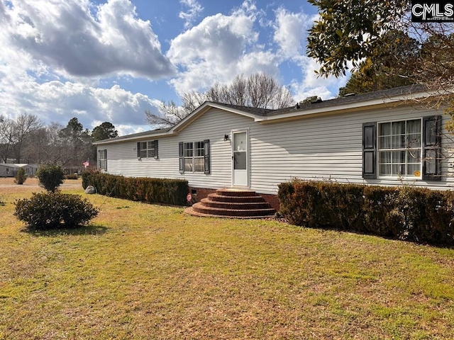 manufactured / mobile home featuring a front yard and crawl space