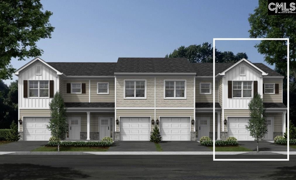 view of property featuring a garage, driveway, and board and batten siding