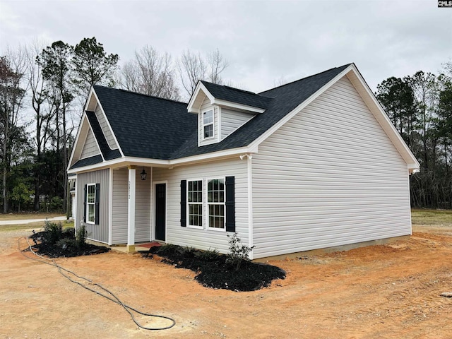 view of front of home featuring a shingled roof