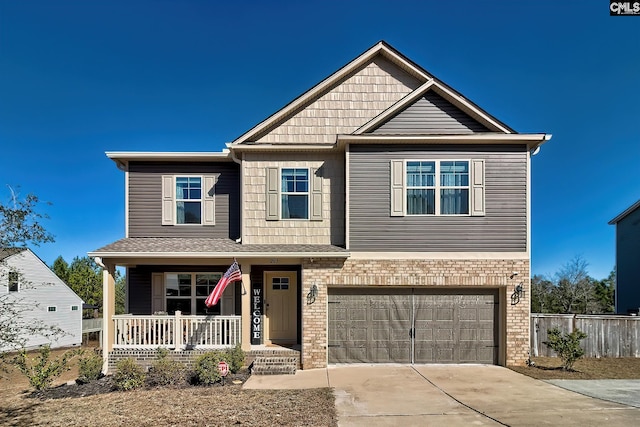 craftsman house featuring a porch, concrete driveway, brick siding, and a garage