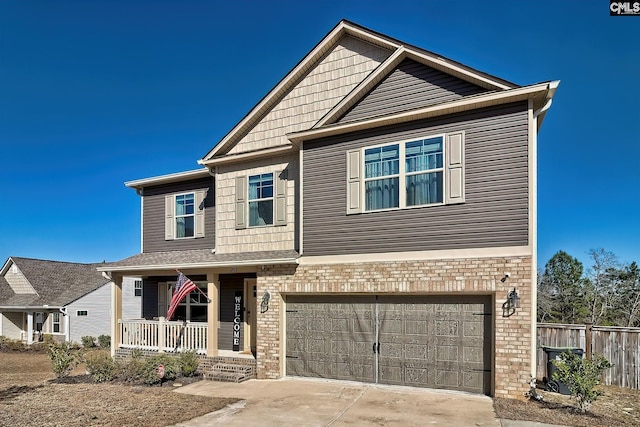 craftsman-style home featuring driveway, an attached garage, a porch, and brick siding