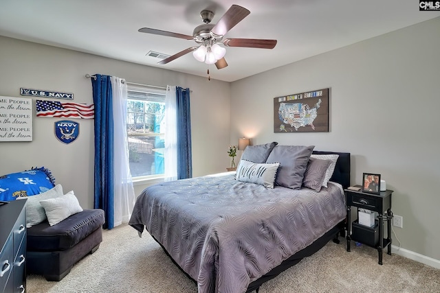 bedroom featuring light colored carpet, visible vents, ceiling fan, and baseboards