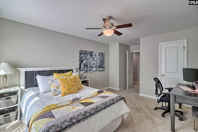 bedroom with light carpet, baseboards, and a ceiling fan