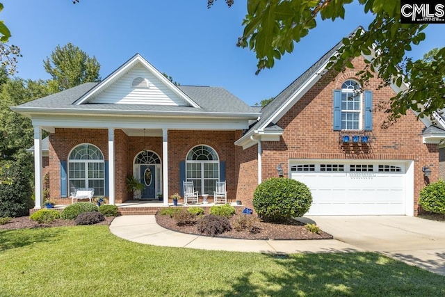 view of front of home with brick siding, a porch, concrete driveway, an attached garage, and a front lawn