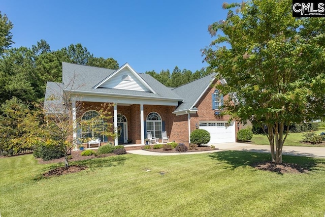 neoclassical / greek revival house featuring driveway, an attached garage, a front lawn, and brick siding