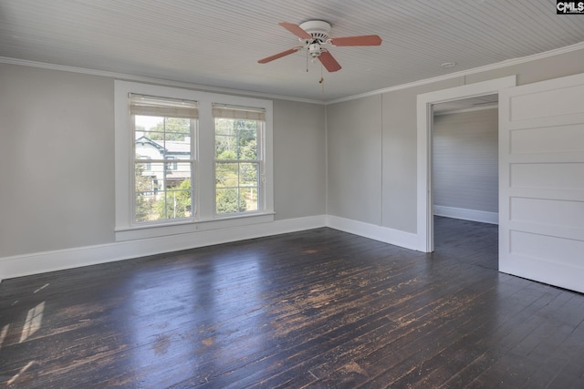 spare room featuring ornamental molding, ceiling fan, baseboards, and dark wood-style floors