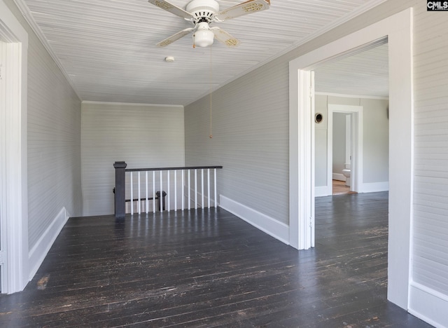 spare room featuring wood-type flooring and ceiling fan