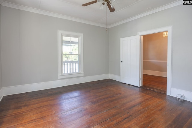 spare room with ornamental molding, ceiling fan, and dark wood-type flooring