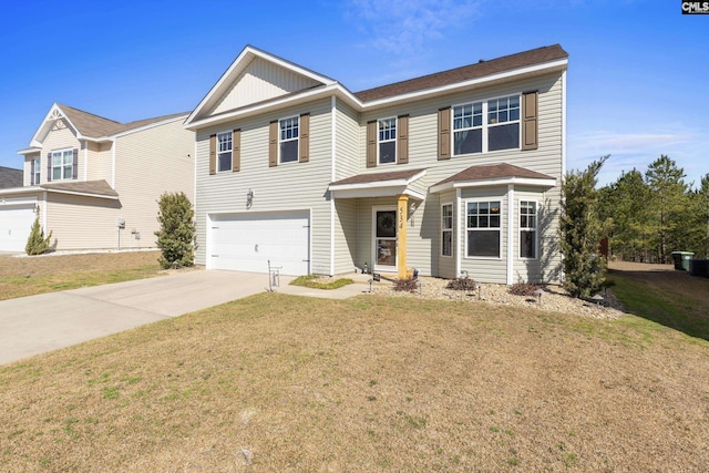 traditional-style home with an attached garage, driveway, and a front lawn