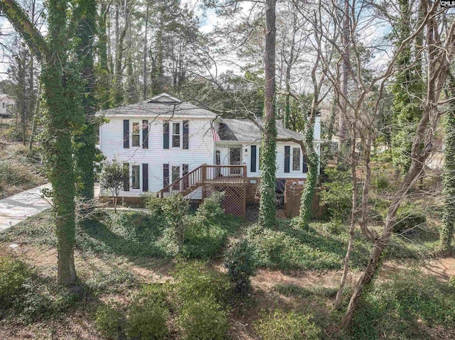 split level home featuring stairs and a deck