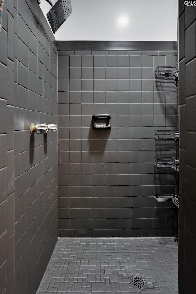 bathroom with a tile shower