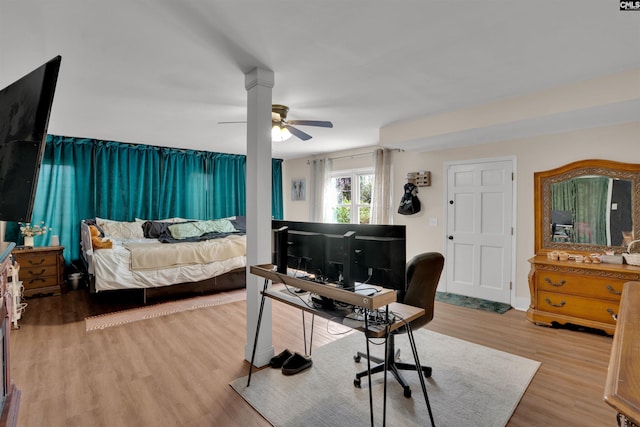 bedroom featuring wood finished floors and a ceiling fan