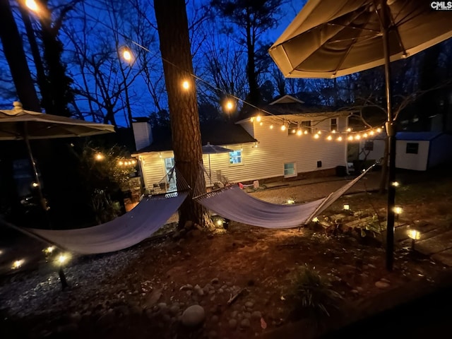 view of yard at twilight