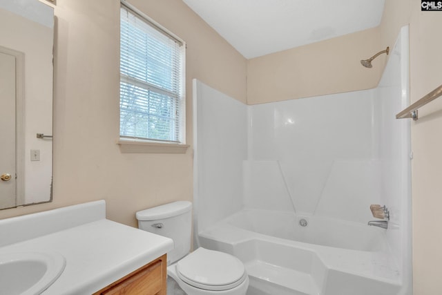 bathroom with toilet, shower / tub combination, and vanity