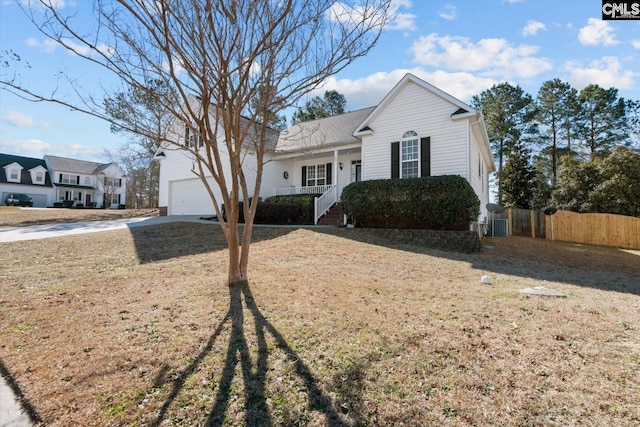 view of front facade featuring a garage, fence, a front lawn, and a porch