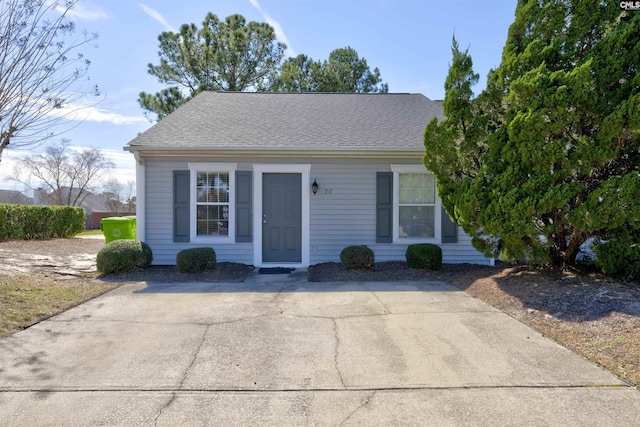 view of front of property featuring roof with shingles