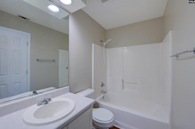 full bath featuring toilet, washtub / shower combination, vanity, and visible vents