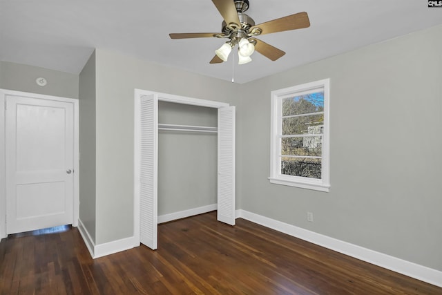 unfurnished bedroom featuring ceiling fan, a closet, wood finished floors, and baseboards