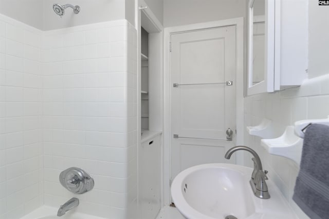 full bathroom with a sink and shower / bathtub combination