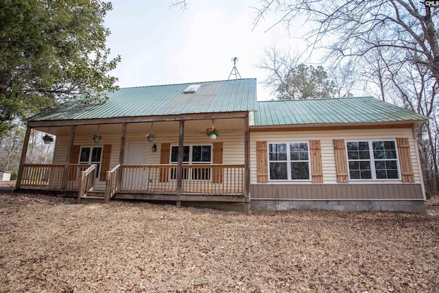 view of front of home featuring a porch and metal roof