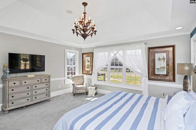 carpeted bedroom featuring crown molding, a tray ceiling, a notable chandelier, and baseboards