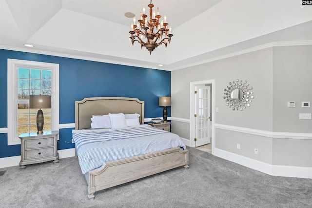 bedroom with crown molding, a notable chandelier, a raised ceiling, carpet flooring, and baseboards