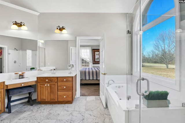 ensuite bathroom featuring marble finish floor, a shower stall, vanity, ensuite bath, and a bath