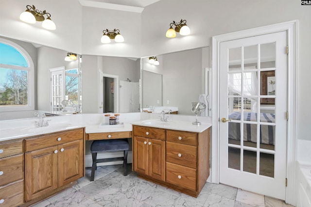 bathroom featuring marble finish floor and vanity