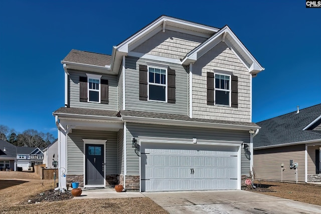 craftsman house featuring a garage, stone siding, and concrete driveway