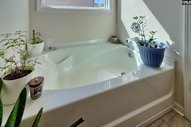 bathroom with a garden tub