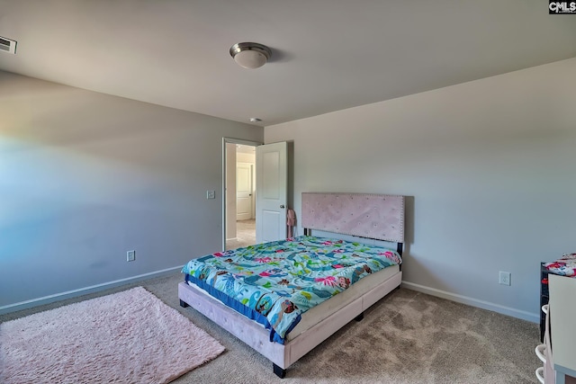 bedroom featuring carpet floors and baseboards