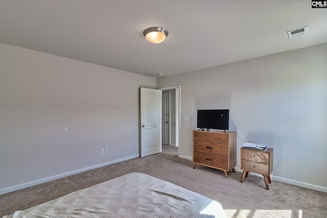 bedroom featuring carpet flooring, visible vents, and baseboards