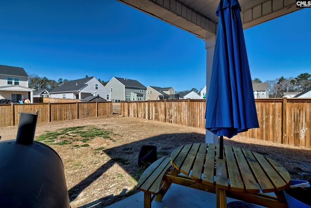 view of yard with a residential view and a fenced backyard