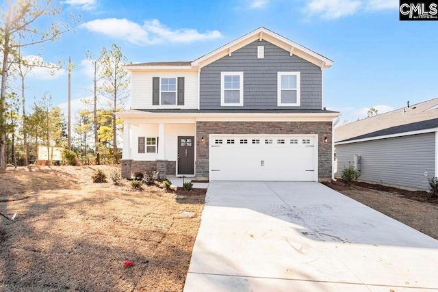 view of front of home featuring a garage, stone siding, and concrete driveway