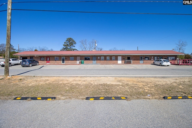 view of property featuring uncovered parking