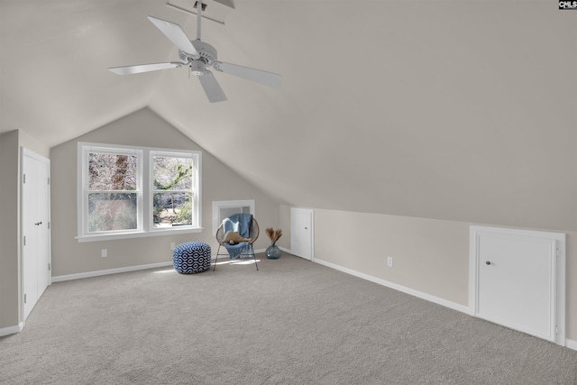 bonus room featuring carpet floors, baseboards, a ceiling fan, and lofted ceiling