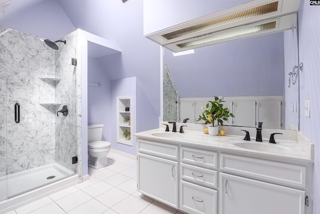 bathroom with a sink, a shower stall, and toilet