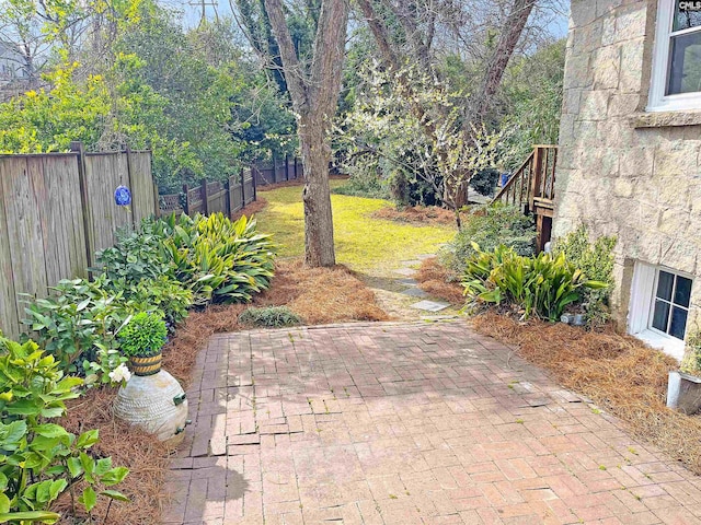 view of patio featuring fence