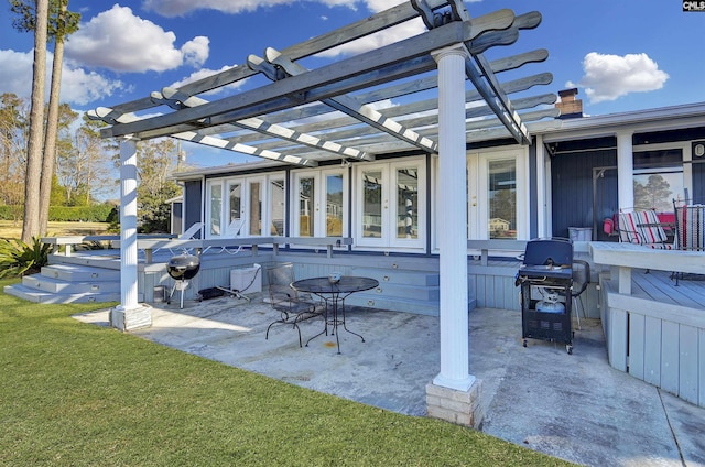 view of patio / terrace with area for grilling and a pergola