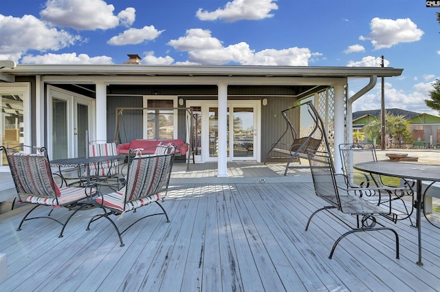 deck featuring outdoor dining area