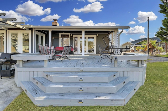 wooden deck featuring grilling area