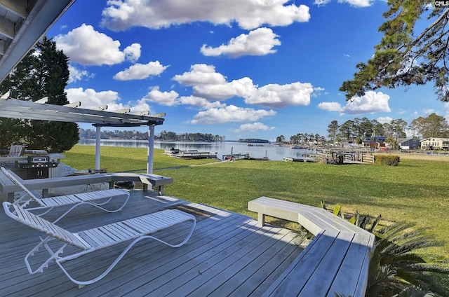 deck featuring a yard and a water view