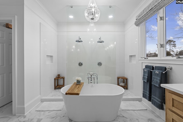 bathroom featuring a soaking tub, marble finish floor, crown molding, and a walk in shower